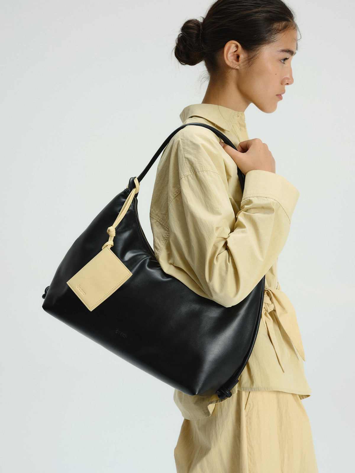 Spacious Vegan Leather Shoulder Bag, Water-Repellent, Zip Closure, Adjustable Knot Strap