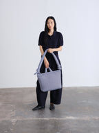 Sac rembourré 100 % nylon recyclé, fermeture zippée, compartiment pour ordinateur portable et tablette