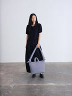 Sac rembourré 100 % nylon recyclé, fermeture zippée, compartiment pour ordinateur portable et tablette
