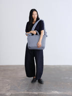 Sac rembourré 100 % nylon recyclé, fermeture zippée, compartiment pour ordinateur portable et tablette