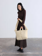 Sac rembourré 100 % nylon recyclé, fermeture zippée, compartiment pour ordinateur portable et tablette