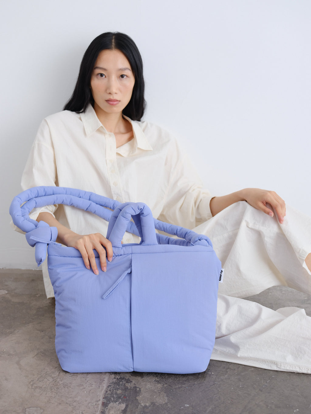 Sac rembourré 100 % nylon recyclé, fermeture zippée, compartiment pour ordinateur portable et tablette