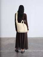 Sac rembourré 100 % nylon recyclé, fermeture zippée, compartiment pour ordinateur portable et tablette
