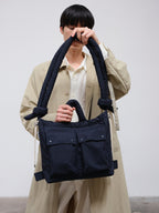 Sac matelassé inspiré de l'imperméable, deux grandes poches, sac à main, porté croisé ou sac à dos